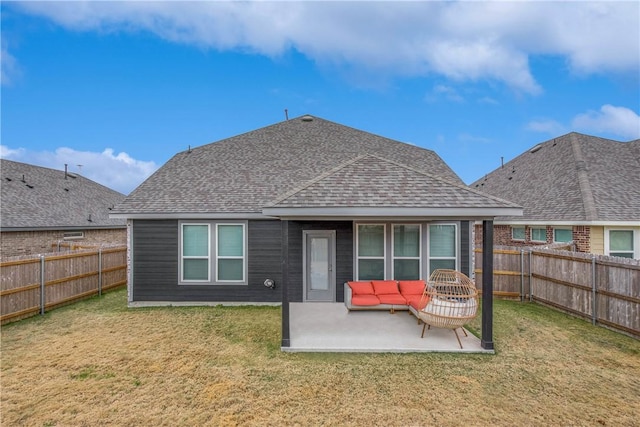 back of property featuring an outdoor living space, a patio area, and a lawn