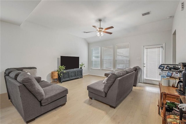 living room featuring ceiling fan, light hardwood / wood-style flooring, and lofted ceiling