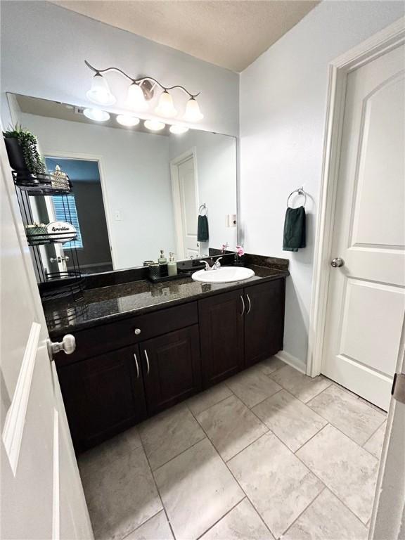 bathroom featuring vanity and tile patterned floors