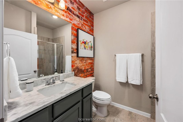 bathroom with tile patterned floors, vanity, toilet, and a tile shower