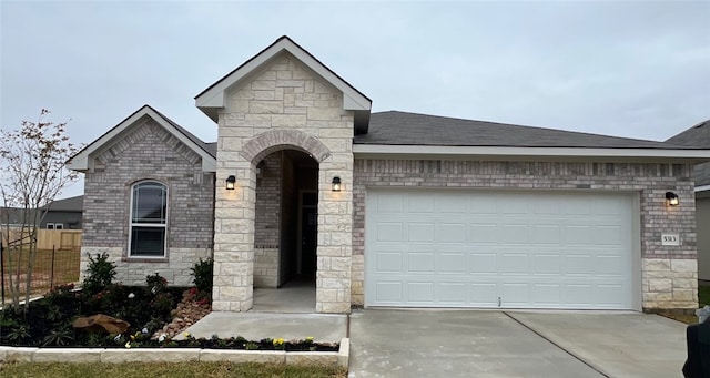 view of front of property with a garage