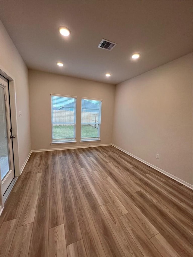 unfurnished room featuring wood-type flooring