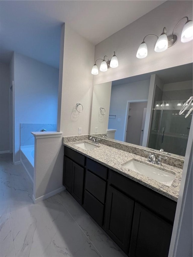 bathroom with separate shower and tub and vanity