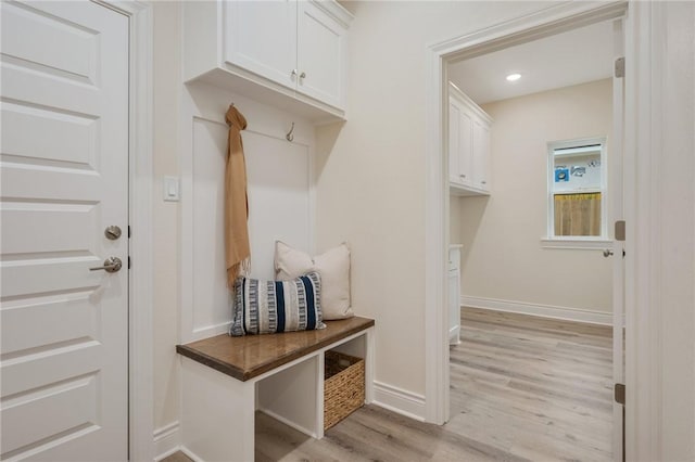 mudroom with light hardwood / wood-style flooring