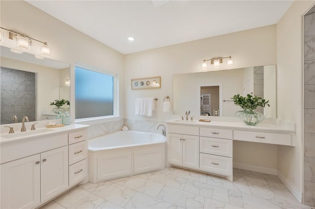 bathroom featuring vanity and a bathtub