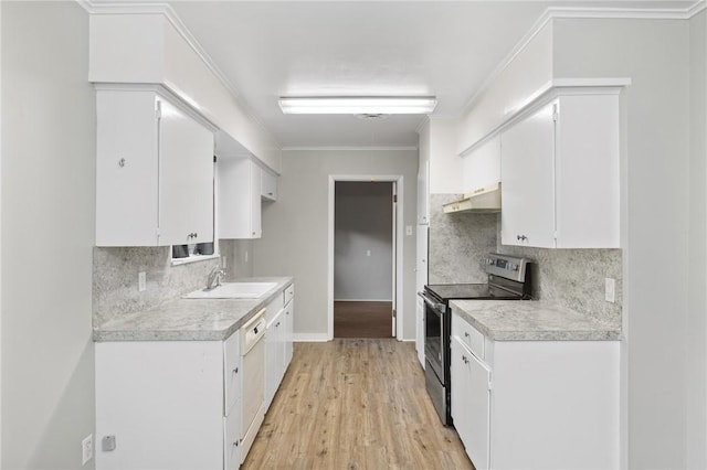 kitchen with light countertops, under cabinet range hood, a sink, and stainless steel range with electric stovetop