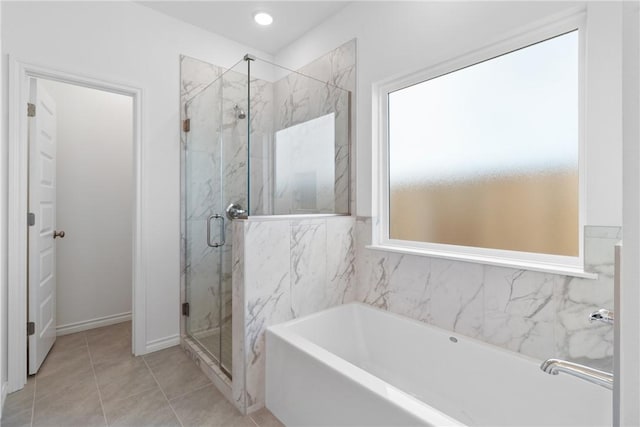 bathroom with tile patterned floors and plus walk in shower