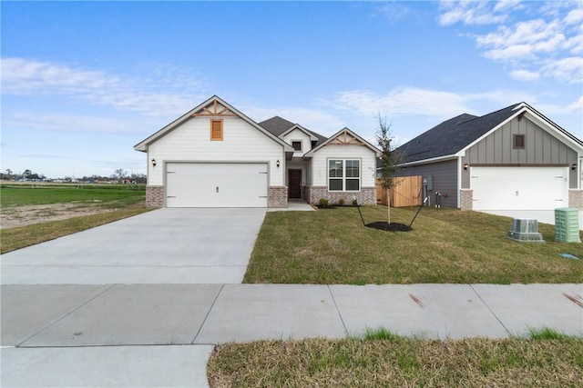 craftsman-style home featuring a garage and a front lawn