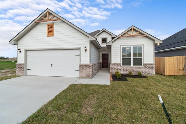 craftsman inspired home with a garage and a front lawn