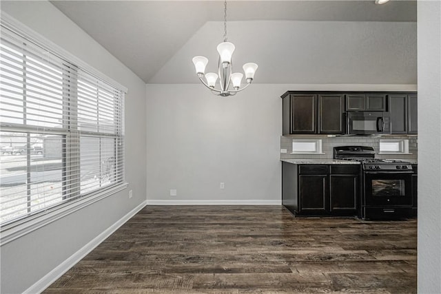 kitchen featuring black appliances, tasteful backsplash, dark wood finished floors, baseboards, and vaulted ceiling