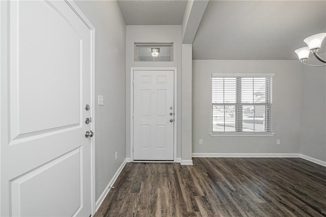 foyer with baseboards and dark wood-style flooring