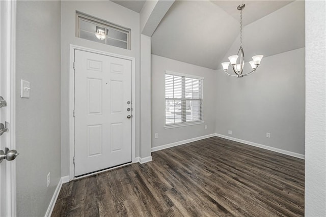 entryway with lofted ceiling, dark wood-style floors, baseboards, and a chandelier