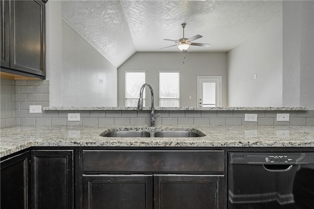 kitchen with a sink, black dishwasher, a textured ceiling, decorative backsplash, and light stone countertops