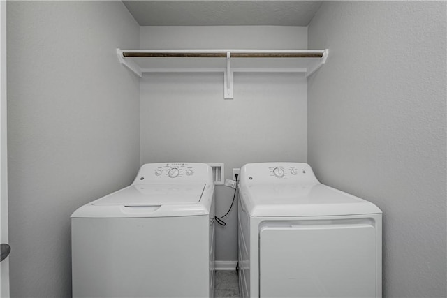 washroom featuring laundry area and independent washer and dryer