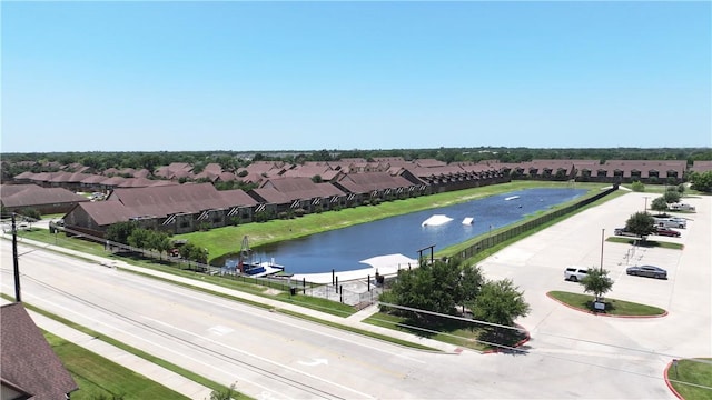 birds eye view of property featuring a residential view and a water view