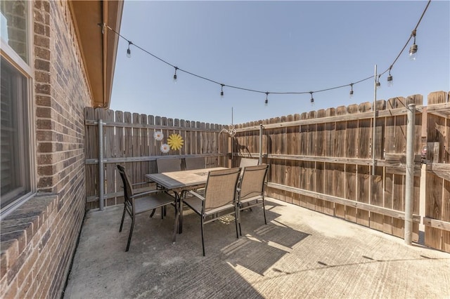 view of patio / terrace with outdoor dining area and a fenced backyard