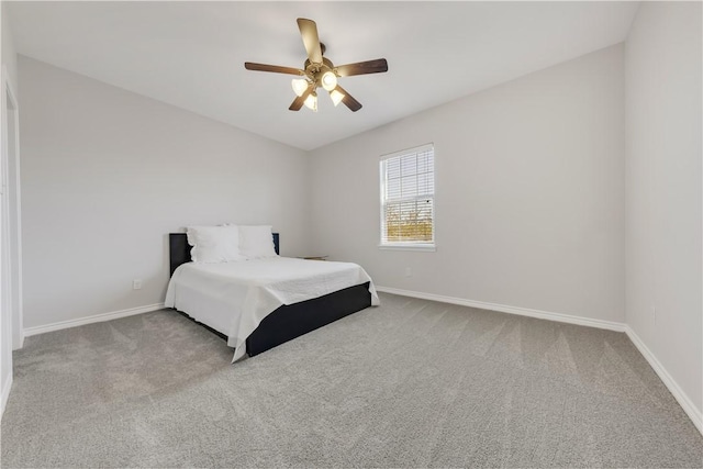 bedroom with carpet, baseboards, and ceiling fan