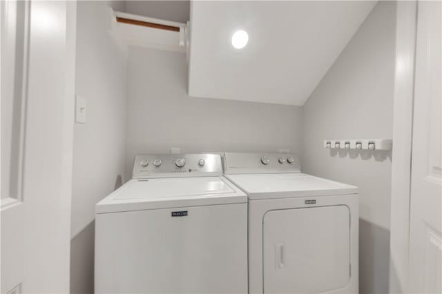 clothes washing area with laundry area and washer and clothes dryer