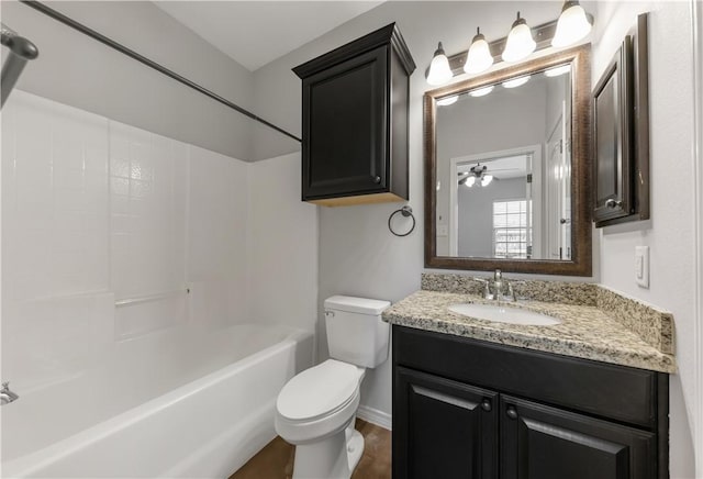 bathroom featuring toilet, vanity, and washtub / shower combination