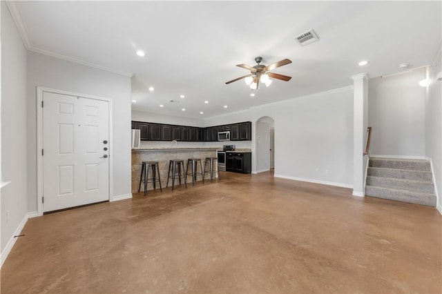 unfurnished living room featuring baseboards, visible vents, finished concrete flooring, and ceiling fan