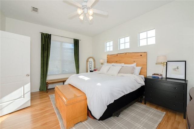 bedroom featuring light hardwood / wood-style flooring and ceiling fan