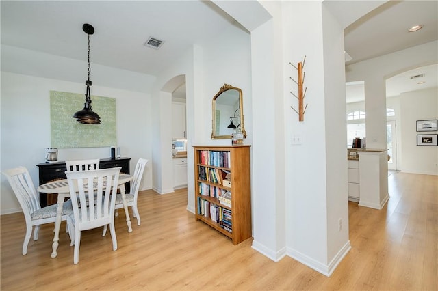 dining area with light hardwood / wood-style floors