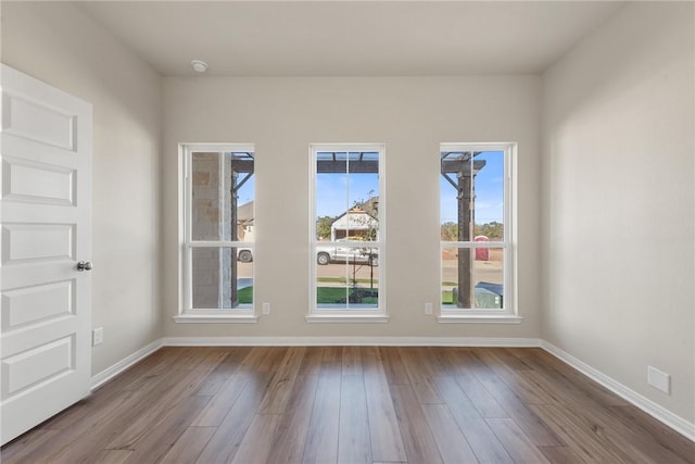 empty room with light hardwood / wood-style floors