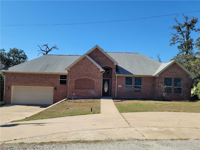 single story home featuring a front yard and a garage