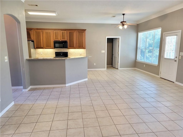 kitchen with light stone countertops, ceiling fan, tasteful backsplash, black appliances, and ornamental molding