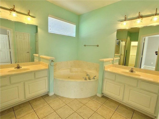 bathroom with tile patterned floors, vanity, and independent shower and bath