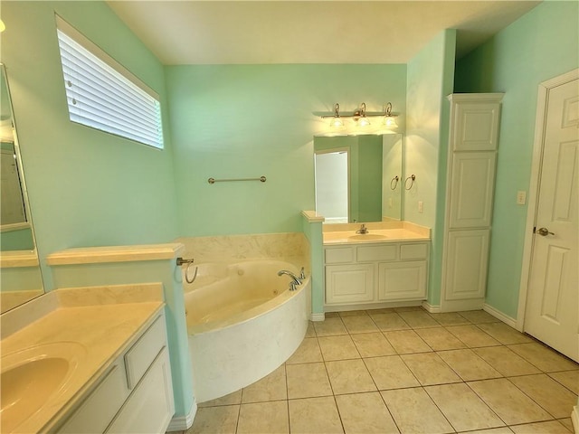 bathroom featuring vanity, tile patterned floors, and a bathtub