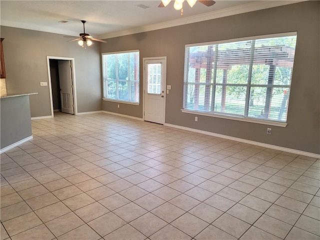 unfurnished living room featuring ceiling fan, light tile patterned flooring, and crown molding