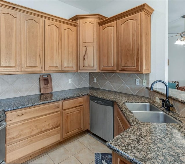 kitchen with decorative backsplash, dishwasher, light tile patterned flooring, and sink