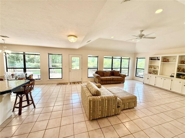 28 Sammy Snead Dr, Hilltop Lakes, TX 77871 - living area with light tile patterned floors, plenty of natural light, a ceiling fan, a textured ceiling, and recessed lighting