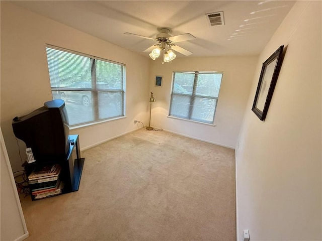 28 Sammy Snead Dr, Hilltop Lakes, TX 77871 - unfurnished room featuring healthy amount of natural light, ceiling fan, carpet floors, and baseboards