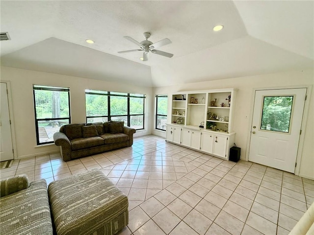 28 Sammy Snead Dr, Hilltop Lakes, TX 77871 - living area featuring plenty of natural light, light tile patterned floors, lofted ceiling, and a ceiling fan