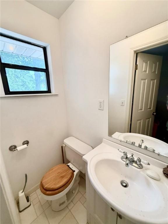 28 Sammy Snead Dr, Hilltop Lakes, TX 77871 - half bath with toilet, tile patterned floors, vanity, and baseboards