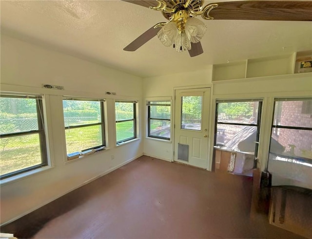 28 Sammy Snead Dr, Hilltop Lakes, TX 77871 - unfurnished sunroom featuring lofted ceiling, plenty of natural light, baseboards, and carpet flooring