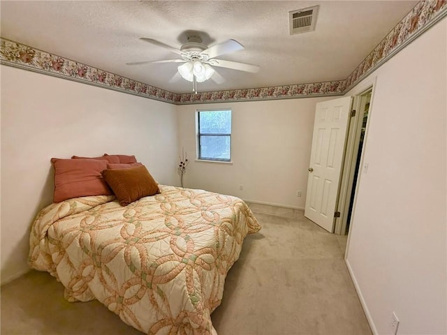 28 Sammy Snead Dr, Hilltop Lakes, TX 77871 - bedroom with light carpet, baseboards, and a ceiling fan