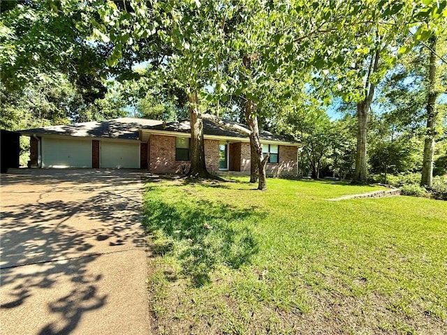 28 Sammy Snead Dr, Hilltop Lakes, TX 77871 - view of front of home with driveway, a garage, brick siding, and a front yard