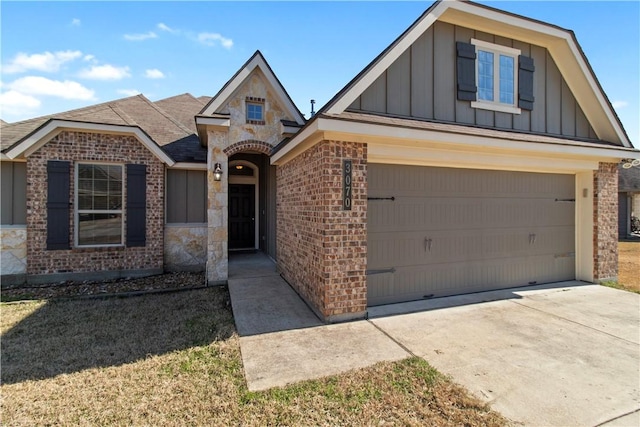 view of front of house with a garage, concrete driveway, board and batten siding, and brick siding