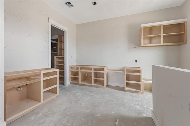 interior space featuring concrete flooring