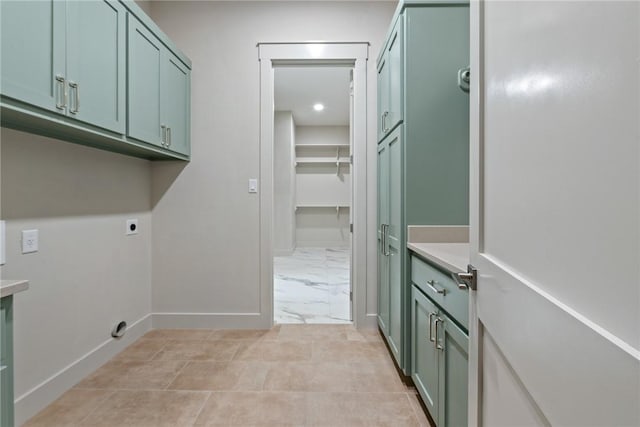 10732 Harvey Ranch Rd, College Station, TX 77845 - washroom with cabinet space, marble finish floor, baseboards, and hookup for an electric dryer