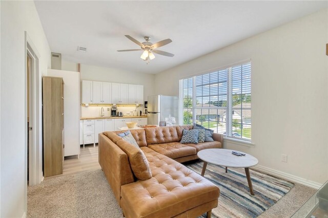 2124 Mountain Wind Loop, Bryan, TX 77807 - living room featuring a ceiling fan and baseboards