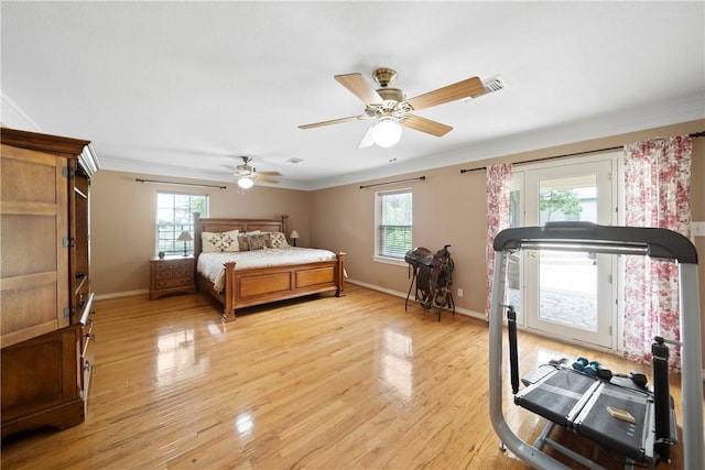 bedroom with ceiling fan, ornamental molding, and light wood-type flooring