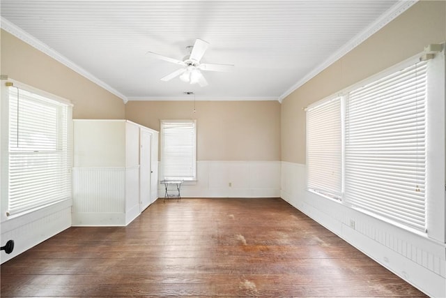 spare room featuring ceiling fan, dark hardwood / wood-style flooring, and ornamental molding