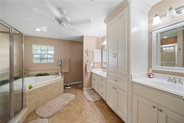 bathroom with tile patterned flooring, vanity, separate shower and tub, and ceiling fan