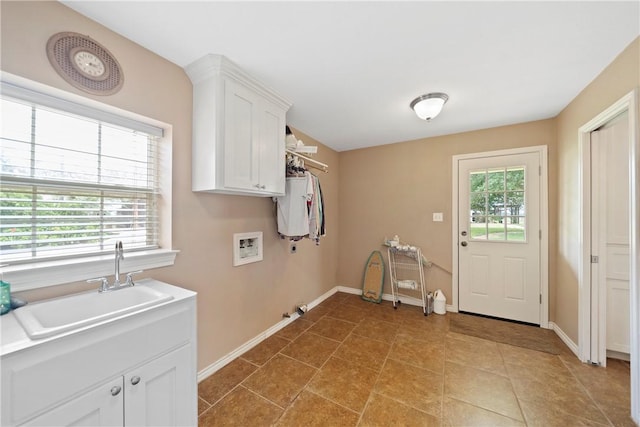 laundry room with washer hookup, cabinets, sink, and a wealth of natural light