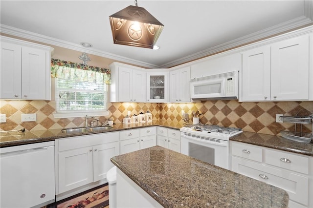 kitchen with ornamental molding, white appliances, sink, pendant lighting, and white cabinets