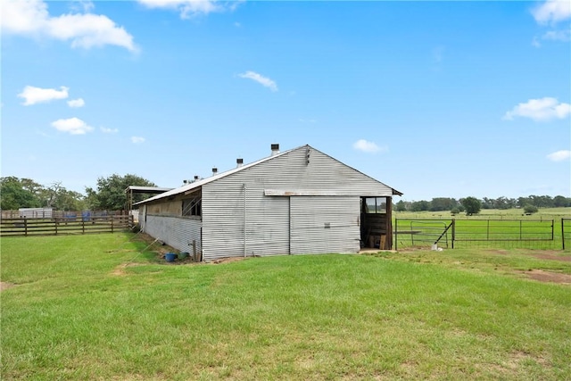 view of outdoor structure with a rural view